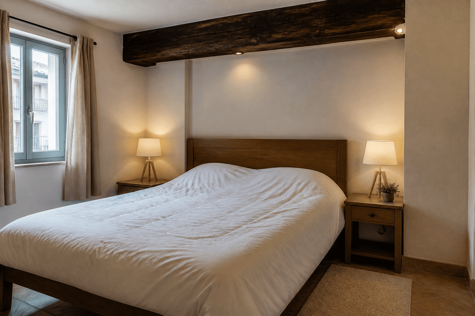 Cream rental bedroom, wood bed under a dark ceiling beam, feng shui ceiling beams over bed