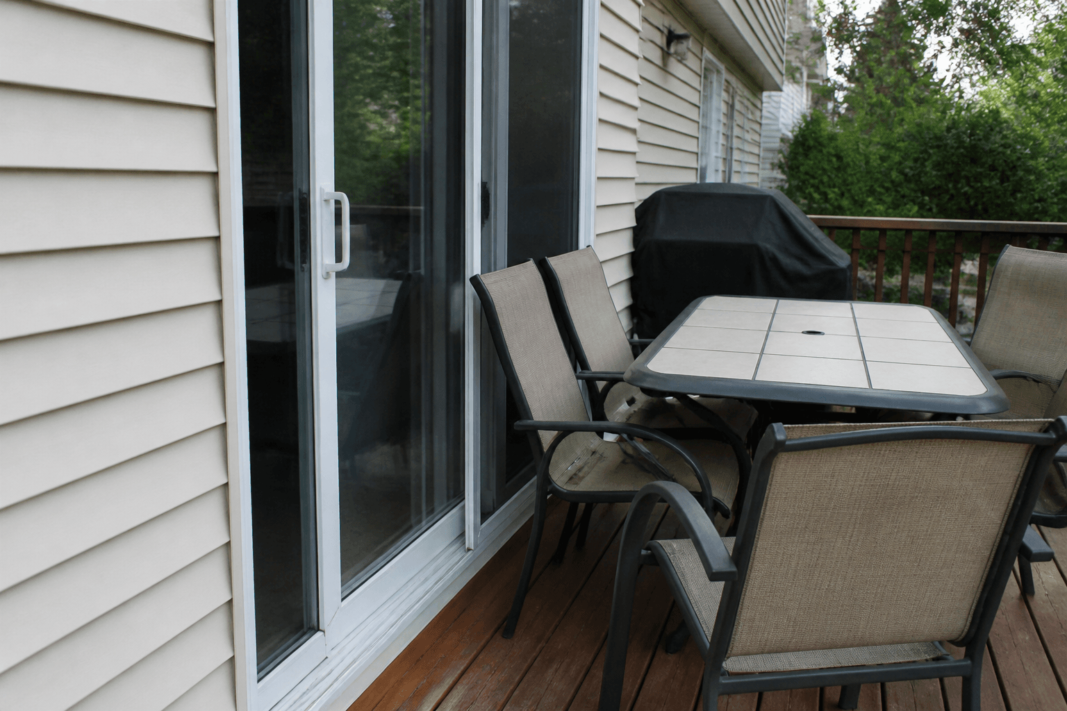 Patio table parked against a sliding glass door so the slider cannot open