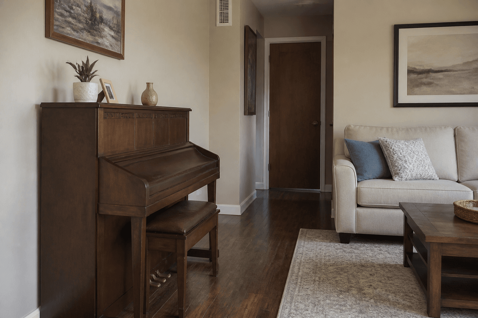 Upright piano on an interior wall with a clear path to the door, feng shui piano placement